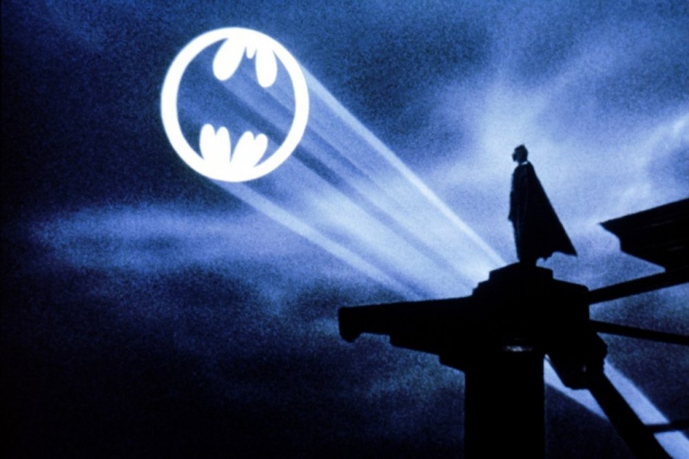 Batman looking at Bat Signal