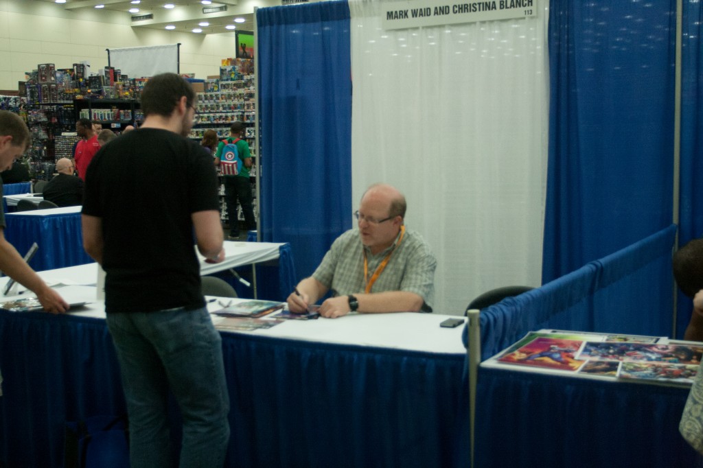 Mark Waid signs comics for fan